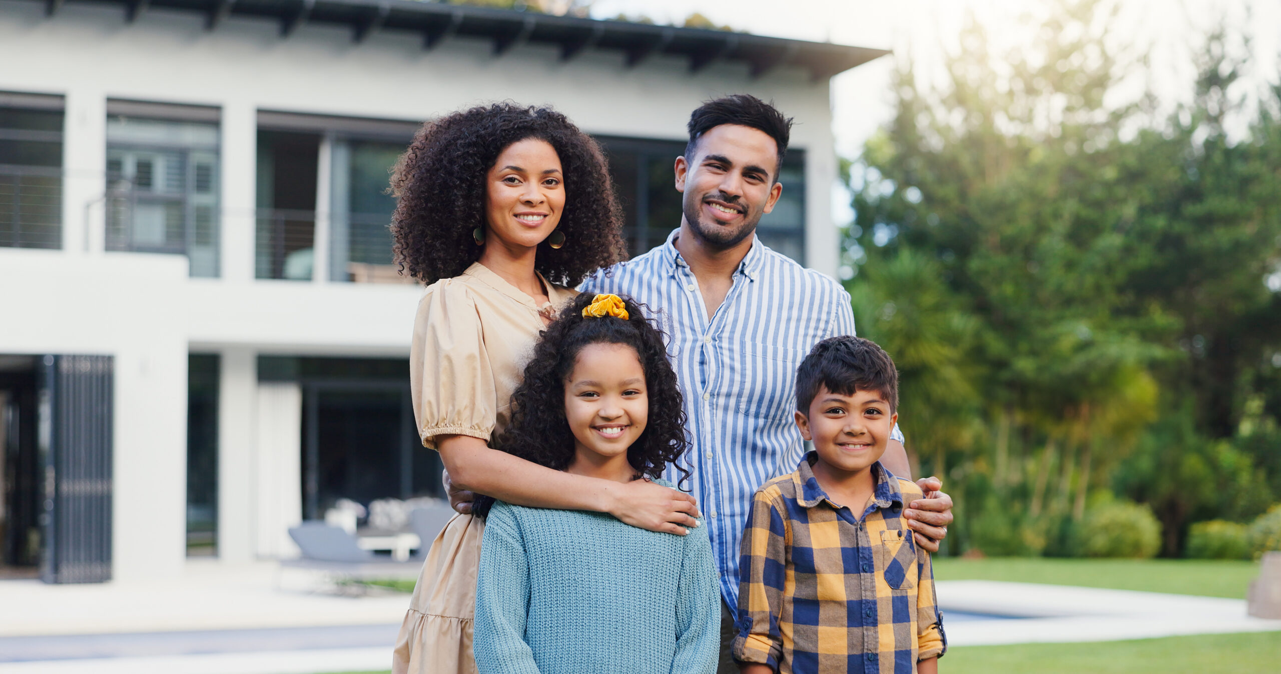 Family outside their new house