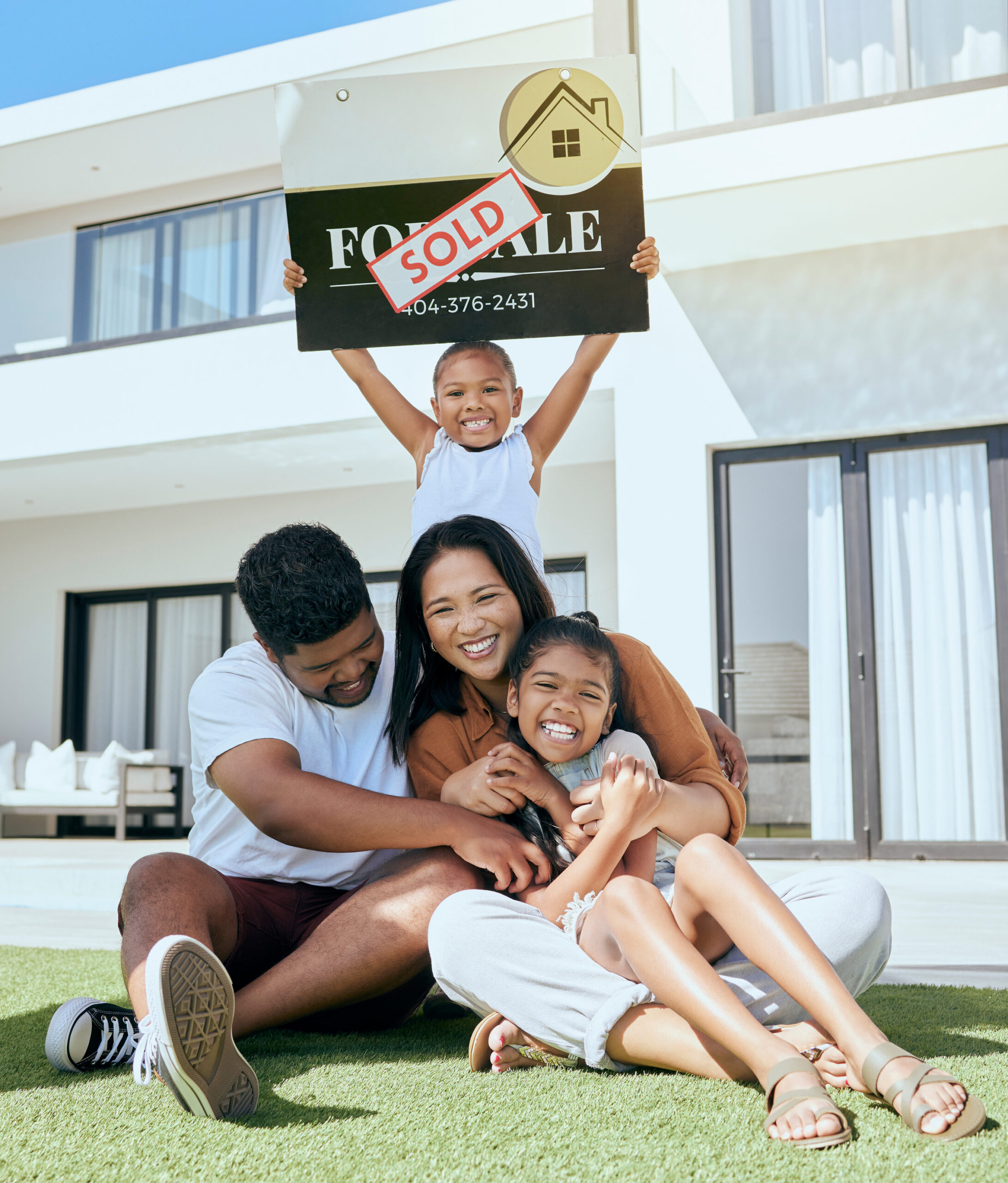Family in the yard of their new Perry Homes house in the Houston area